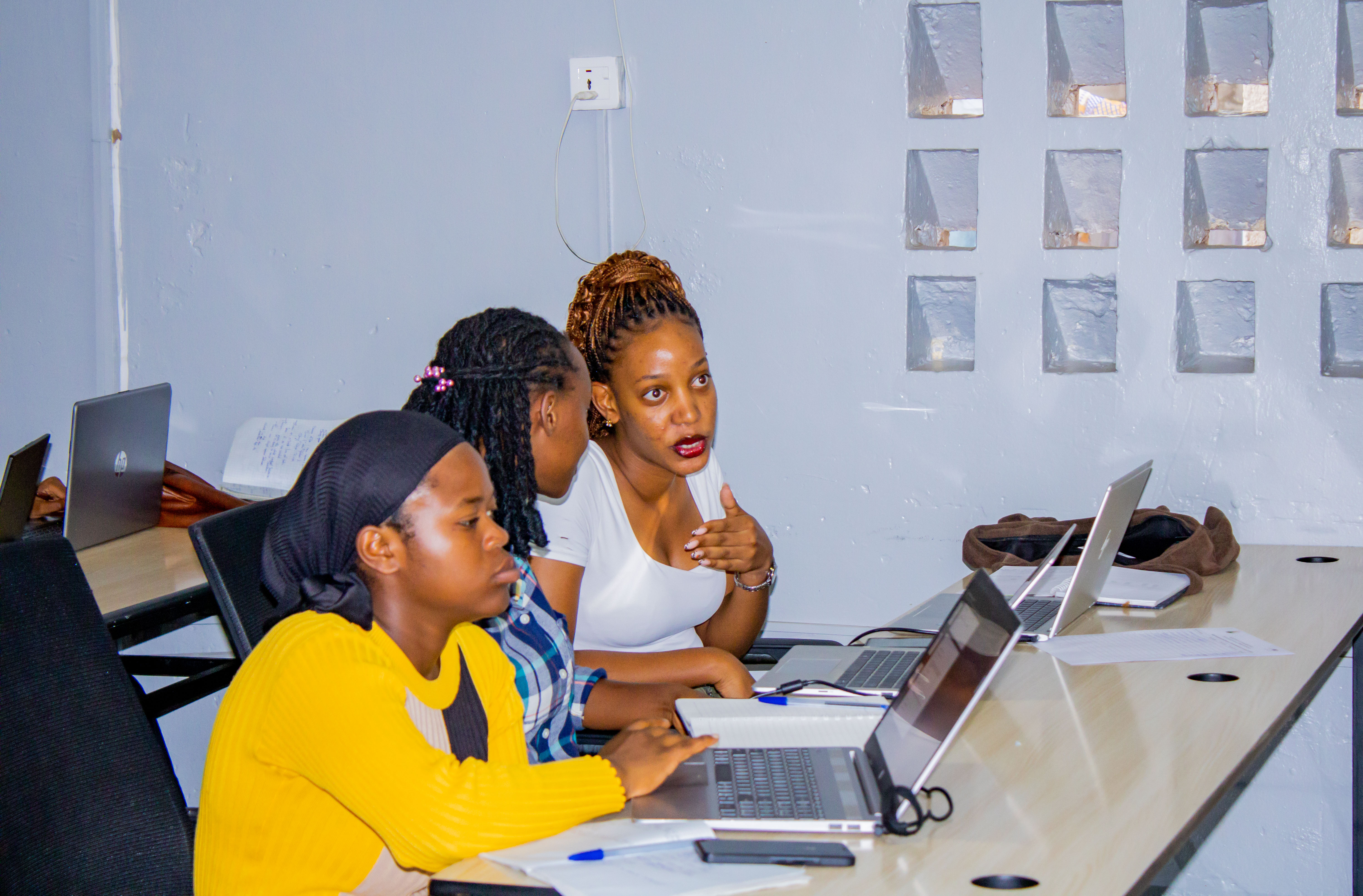 Delucie learning alongside her SheCanCODE classmates